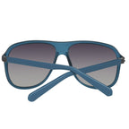 Lunettes de soleil Guess bleues en plastique, verres dégradés gris-bleu.