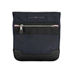 Sac bandoulière bleu marine Tommy Hilfiger, détails contrastés, poche zippée et sangle réglable.