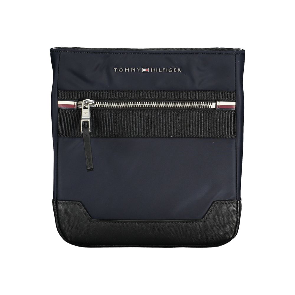 Sac bandoulière bleu marine Tommy Hilfiger, détails contrastés, poche zippée et sangle réglable.