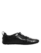 Dolce & Gabbana sneakers noires en cuir crocodile et veau, semelle caoutchouc, lacets, low-top.