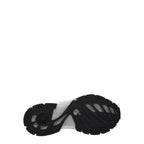 Semelle extérieure noire d’une sneaker en tissu blanc, style casual à lacets.